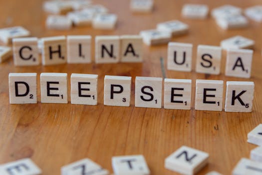 Wooden letter tiles spelling "DEEPSEEK" with "CHINA" and "USA" on a wooden table.
